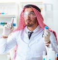 Arab chemist scientist testing quality of oil petrol Royalty Free Stock Photo