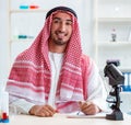 Arab chemist working in the lab office