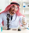 Arab chemist working in the lab office