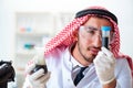 The arab chemist working in the lab office