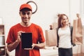 Arab Deliveryman with Tablet and Girl with Packege