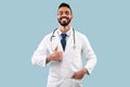 Arab Doctor Male Gesturing Thumbs Up Posing Over Blue Background Royalty Free Stock Photo