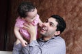 Arab egyptian baby girl playing with her father Royalty Free Stock Photo