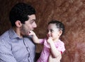 Arab egyptian baby girl playing with her father Royalty Free Stock Photo