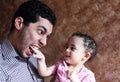 Arab egyptian baby girl playing with her father Royalty Free Stock Photo