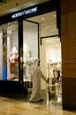 Arab Emirati Man entering a shop in a mall