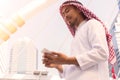 Arab entrepreneur use mobile phone.