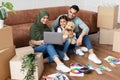 Arab family using pc in their new apartment Royalty Free Stock Photo