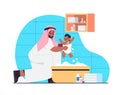 Arab father bathing little son in bath tub fatherhood parenting concept dad spending time with baby at home