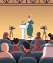 Arab female doctor giving speech at tribune with microphone medical conference meeting