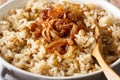 Arab food: Mujaddara from rice and lentils with caramelized onion close-up. horizontal Royalty Free Stock Photo