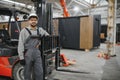 Arab forklift operator posing in modular house production workshop Royalty Free Stock Photo