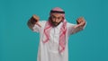 Arab guy with national gown and kufiyah Royalty Free Stock Photo