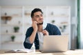 Arab guy office worker removing face mask, rubbing beard