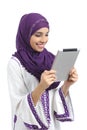 Arab happy woman reading a tablet reader