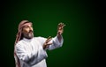 Arab healer performs energy work using hands, channeling spiritual forces for holistic well-being and relaxation