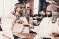 Arab holding bowl of candy and treats friend