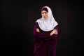 Arab indignant woman in hijab stands