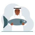 A arab male fisherman holds a large fish, proud of good fishing or hunting. Hobby, fishing concept. Royalty Free Stock Photo