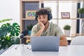 Arab man with beard working at the radio thinking looking tired and bored with depression problems with crossed arms Royalty Free Stock Photo