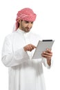 Arab man browsing a digital tablet