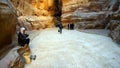 Arab man cleaner in the canyon in ancient city of Petra in Jordan