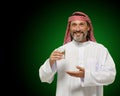 Arab man holding glass of water, conveying a sense of healthy living and mindfulness. It emphasizes importance of