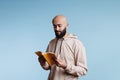 Arab man holding open book Royalty Free Stock Photo