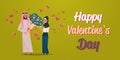 Arab man present woman bouquet of flowers happy valentines day holiday concept arabic couple in love over pink heart Royalty Free Stock Photo