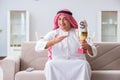 The arab man with prize and money on sofa Royalty Free Stock Photo