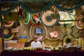 An Arab man selling traditional crafts at a market stall in Doha Royalty Free Stock Photo