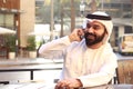Arab Man Smiling And Speaking In phone