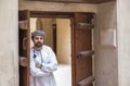 Arab man in traditional omani outfit in an old castle