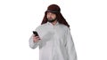 Arab man using his smartphone surfing on the internet or messagi