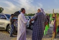 Arab men chatting at rural market Royalty Free Stock Photo