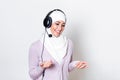 Arab middle eastern businesswoman with headphones customer representative business woman with phone headset helping and supporting Royalty Free Stock Photo