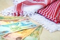 Arab Money Dirham Bank notes  and Traditional Arab Male Scarf - kaffiyah Royalty Free Stock Photo