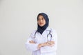 Arab Muslim doctor or nurse standing uniform white has stethoscope in the hospital, Portrait young hijab of a smiling area Royalty Free Stock Photo