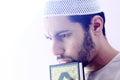 Arab muslim man with koran holy book Royalty Free Stock Photo