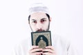 Arab muslim man with koran holy book Royalty Free Stock Photo