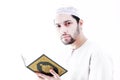 Arab muslim man with koran holy book Royalty Free Stock Photo