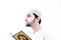 Arab muslim man with koran holy book Royalty Free Stock Photo