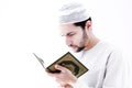 Arab muslim man with koran holy book Royalty Free Stock Photo