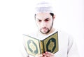 Arab muslim man with koran holy book Royalty Free Stock Photo