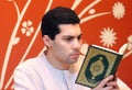 Arab muslim man with koran holy book Royalty Free Stock Photo