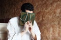 Arab muslim man with koran holy book with rosary Royalty Free Stock Photo