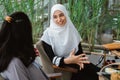 Arab muslim woman in conversation