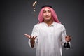 The arab with oil on gray background Royalty Free Stock Photo