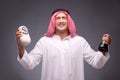 The arab with oil on gray background Royalty Free Stock Photo