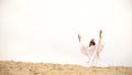 Arab raising hands to heaven, praying on knees, asking Allah to forgive sins Royalty Free Stock Photo